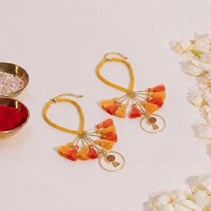 Orange Tassel And Enamel Lumba Bandhan Rakhi For Her (Set of 2)