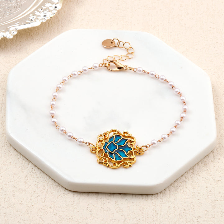 Serenity Lotus Blue Charm Gold Bracelet - Salty Accessories