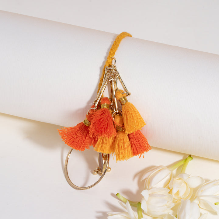 Orange Tassel And Enamel Lumba Bandhan Rakhi For Bhabhi