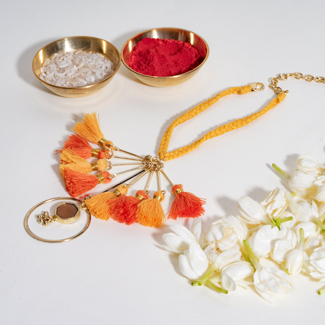 Orange Tassel And Enamel Lumba Bandhan Rakhi For Bhabhi