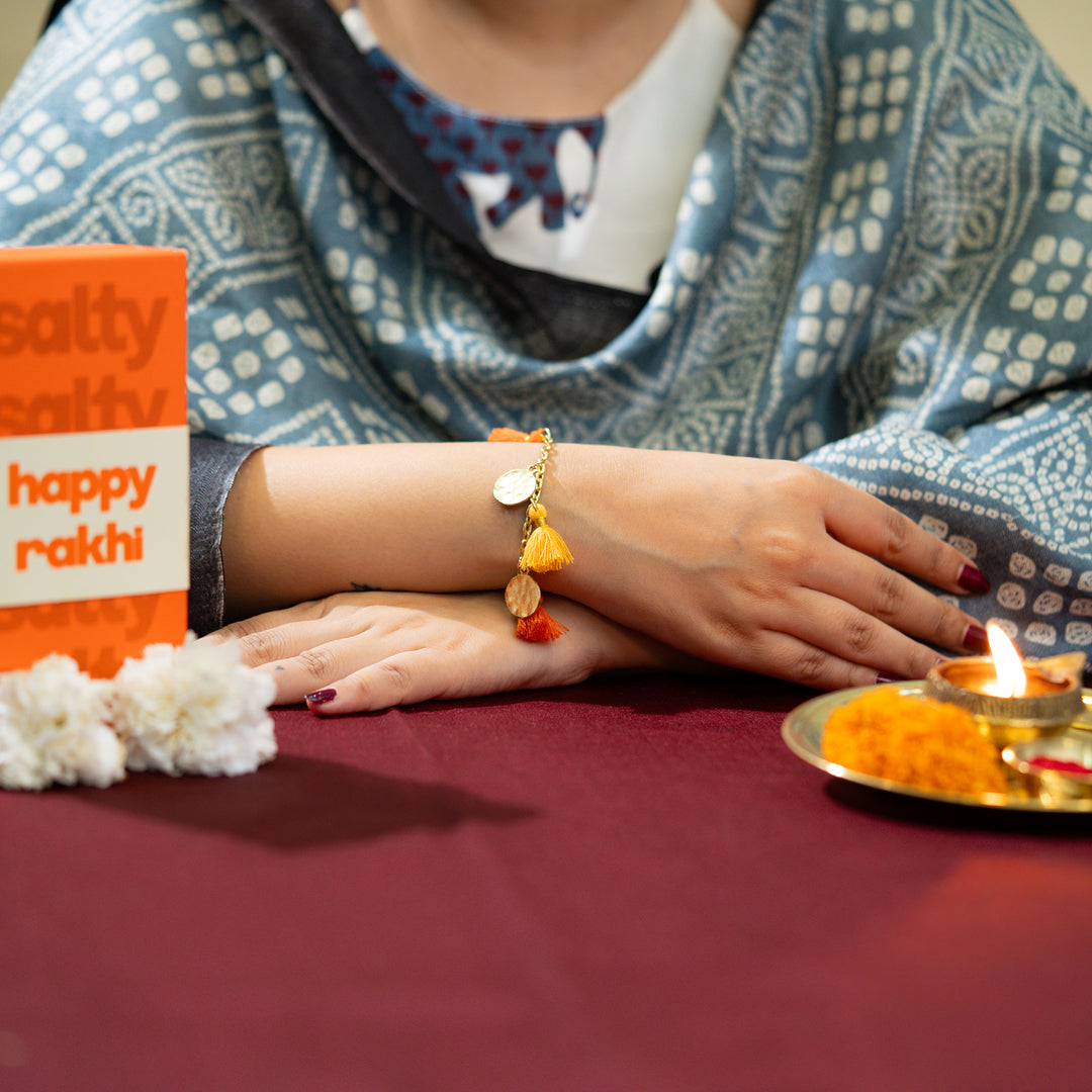 Orange Tassel Coin Hanging Bandhan Rakhi