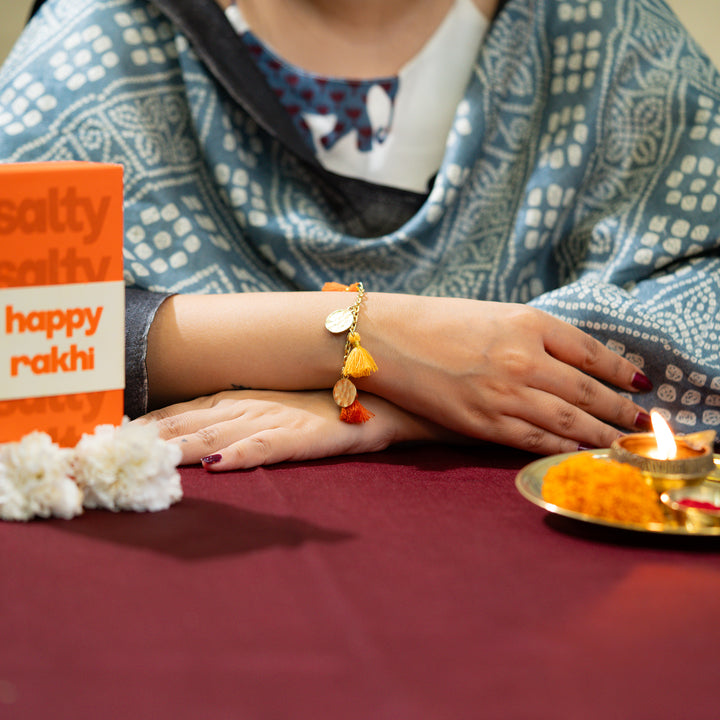 Orange Tassel Coin Hanging Bandhan Rakhi
