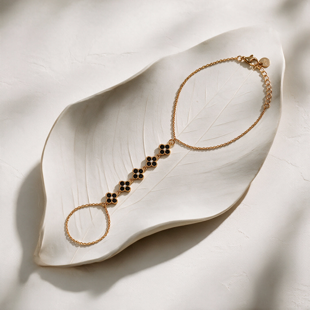 Noir Bloom Clover Gold toned Hand Chain
