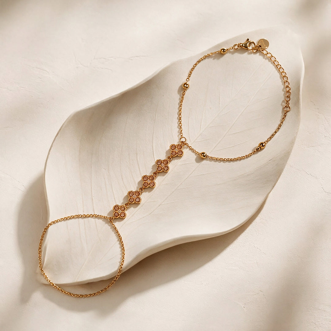 Crystal Bloom Clover Gold toned Hand Chain