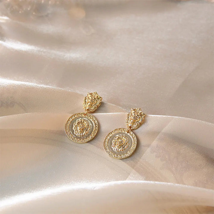 Carved Lion Dented Gold Stud Earrings