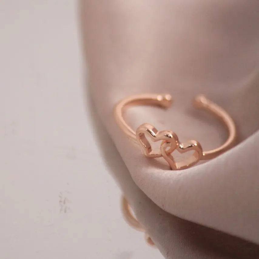 Interlinked heart rose-gold ring