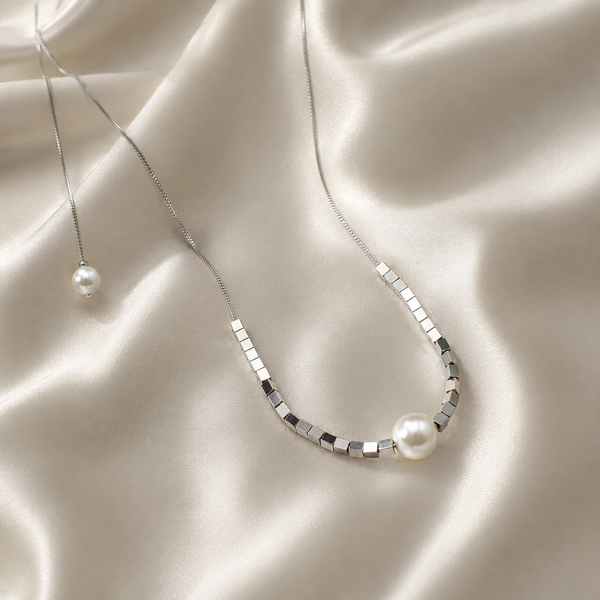 Shimmering Love Knot Pearl Necklace