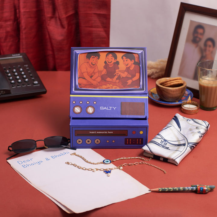 The Couple Edit Rakhi TV Gift Hamper For Bhaiya and Bhabhi