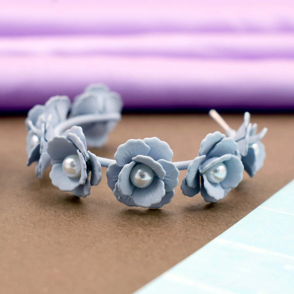 Acrylic bluish-grey flower hoop earrings