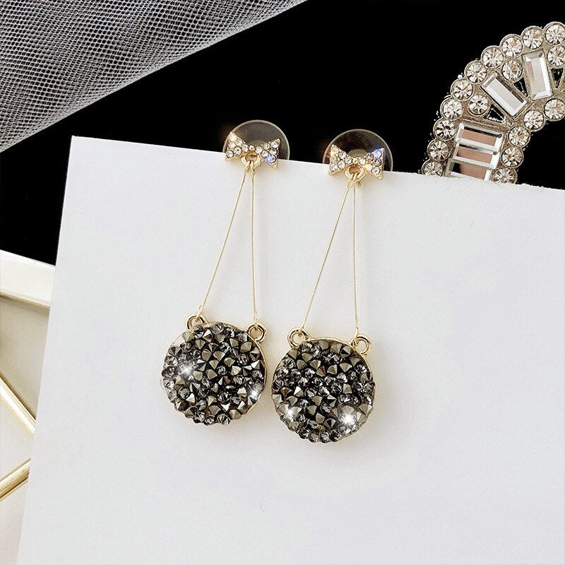 Black Studded Bow Sleek Earrings