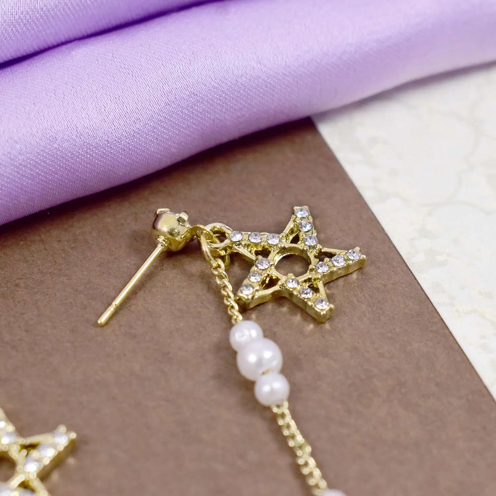 Studded star pearl dangle gold earrings